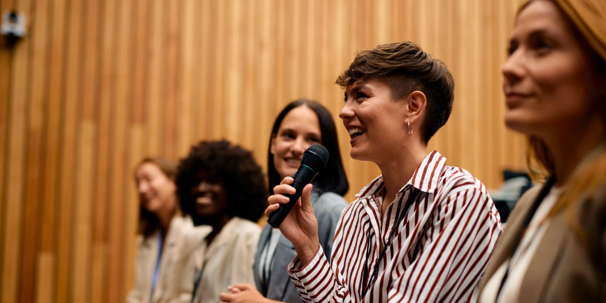 Women leaders speaking at an insurance industry leadership event in recognition of International Women’s Day, highlighting diversity and leadership in insurance.