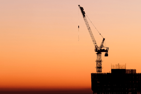 A constuction frame againt a sunset sky