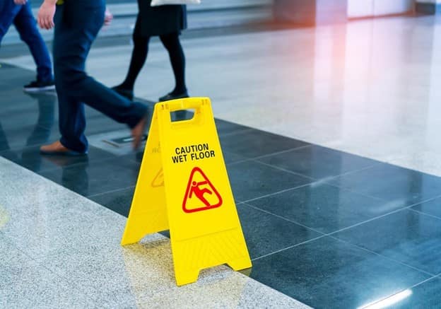 A wet floor sign in a public place 