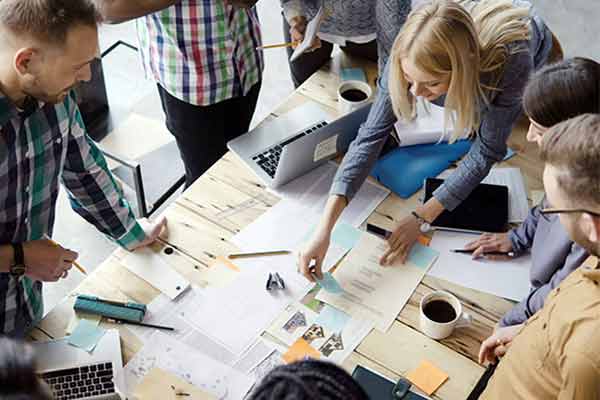 A team brainstorming together around a table.