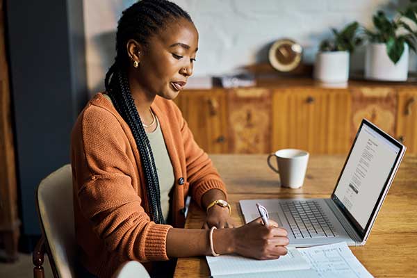 A small business owner calculating the late payment interest she can charge her client.