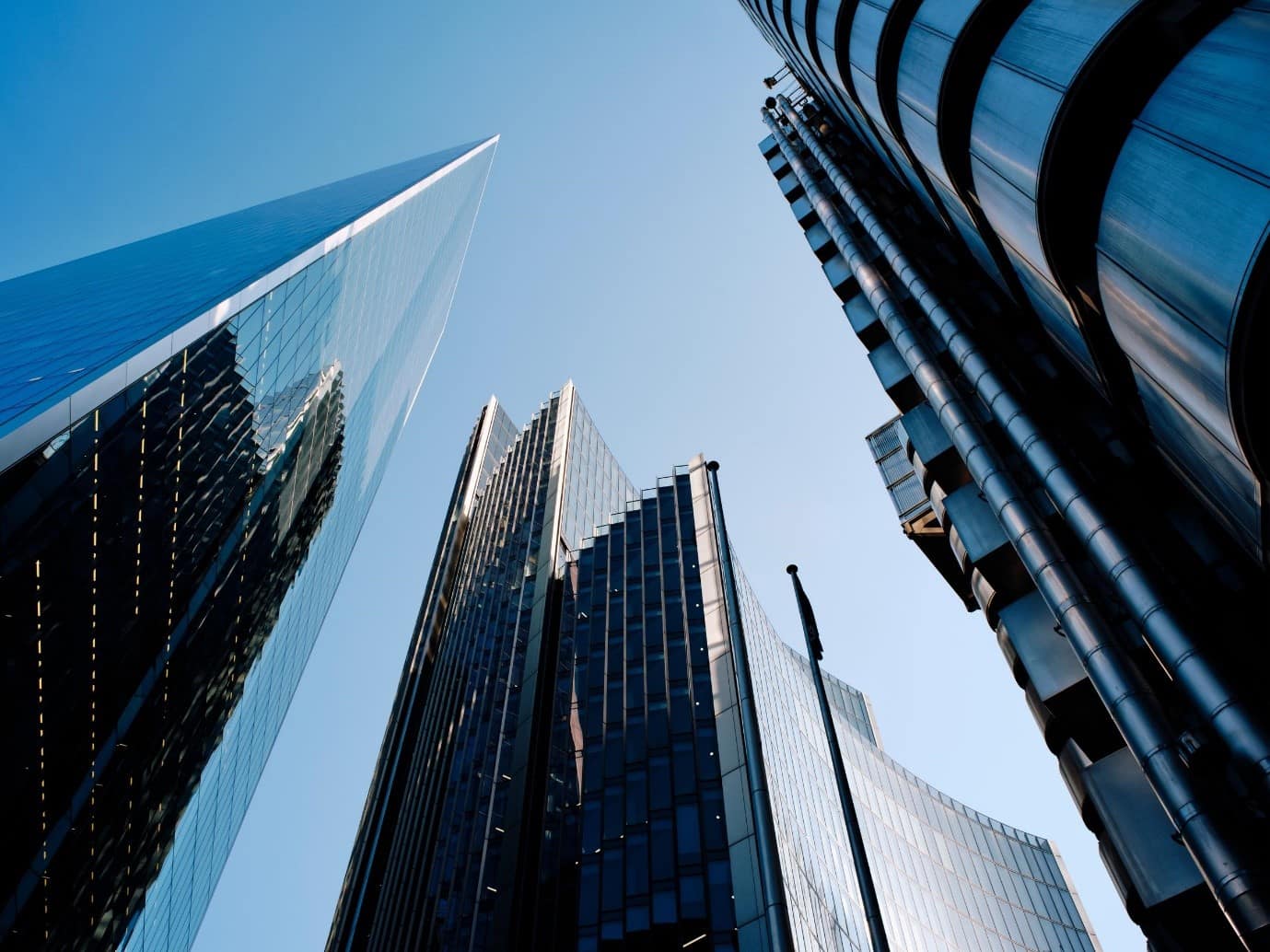 A view of London skyscrapers in the financial district, with a blue sky in the background