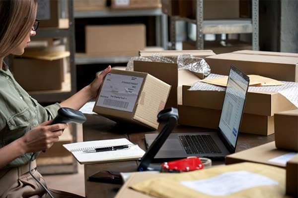 A small online retail business owner getting ready to ship an order.