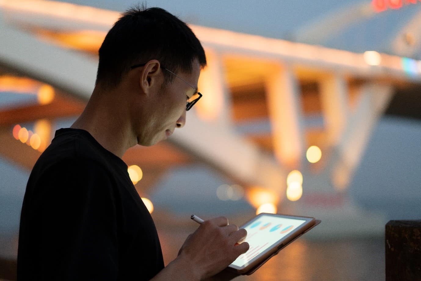 Someone holding their electronic tablet