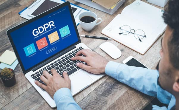 businessman researching GDPR on a laptop