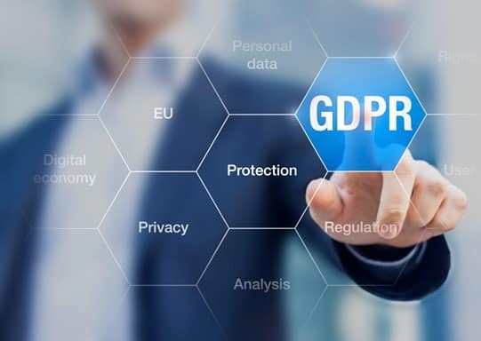 A businessman pressing GDPR graphic on the screen