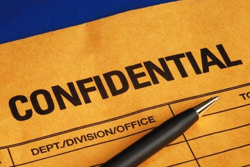 A piece of paper with 'confidentiality' written on it