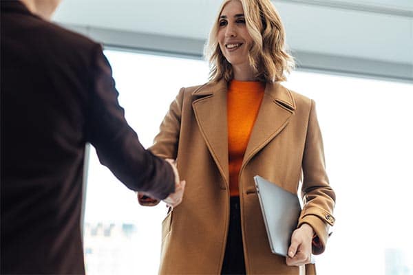 Business partners shaking hands.