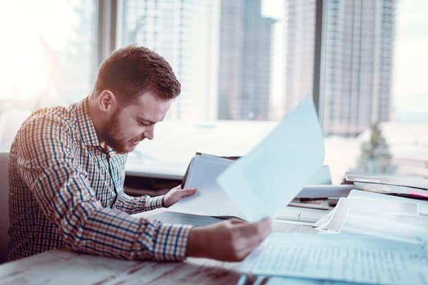 A young contractor reviewing his taxes. 