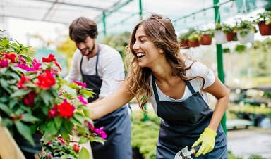 Two volunteers helping in a community garden
