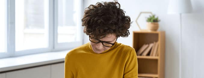 Woman looking down at paperwork