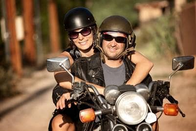 Man and woman on motorcycle