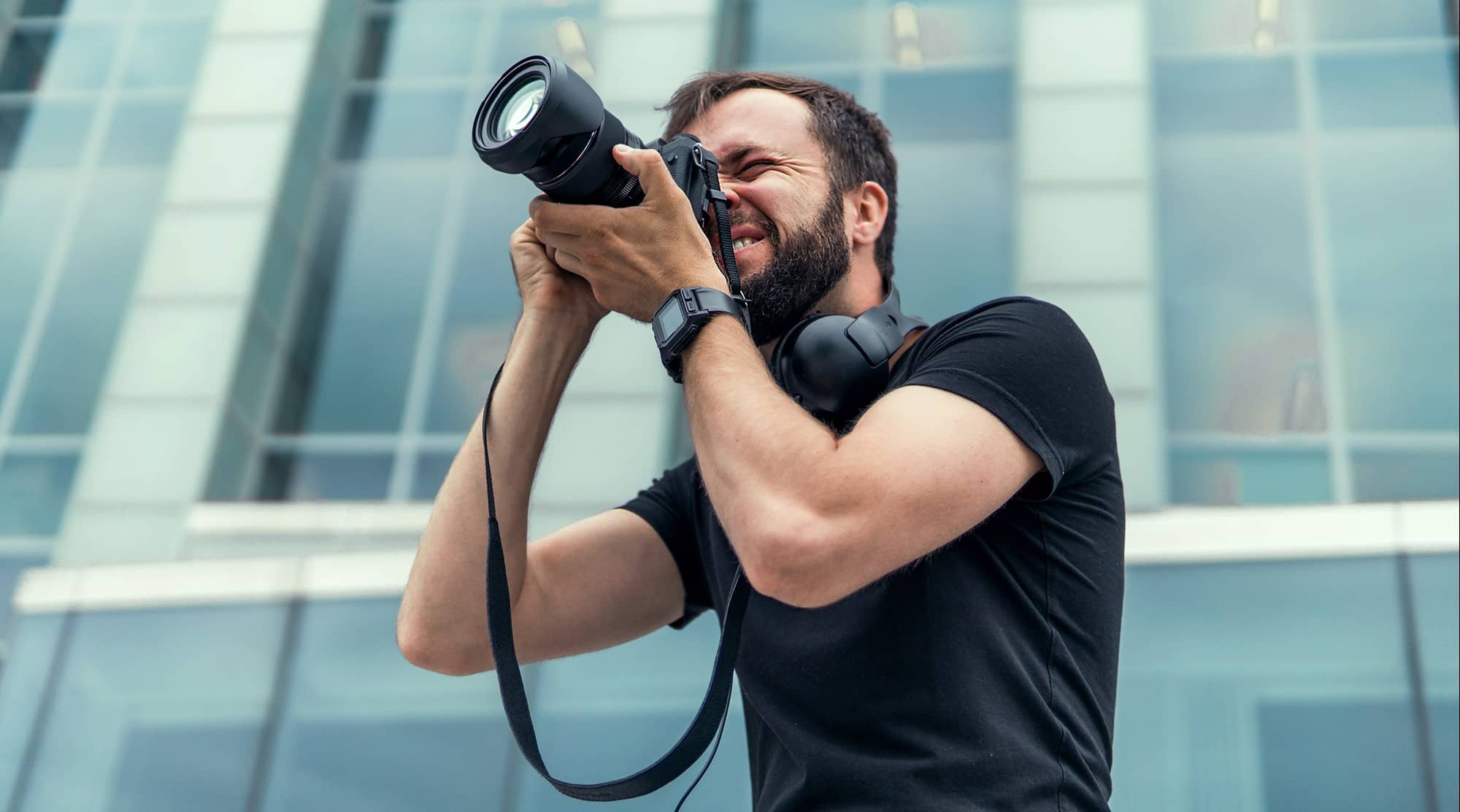 male photographer using camera