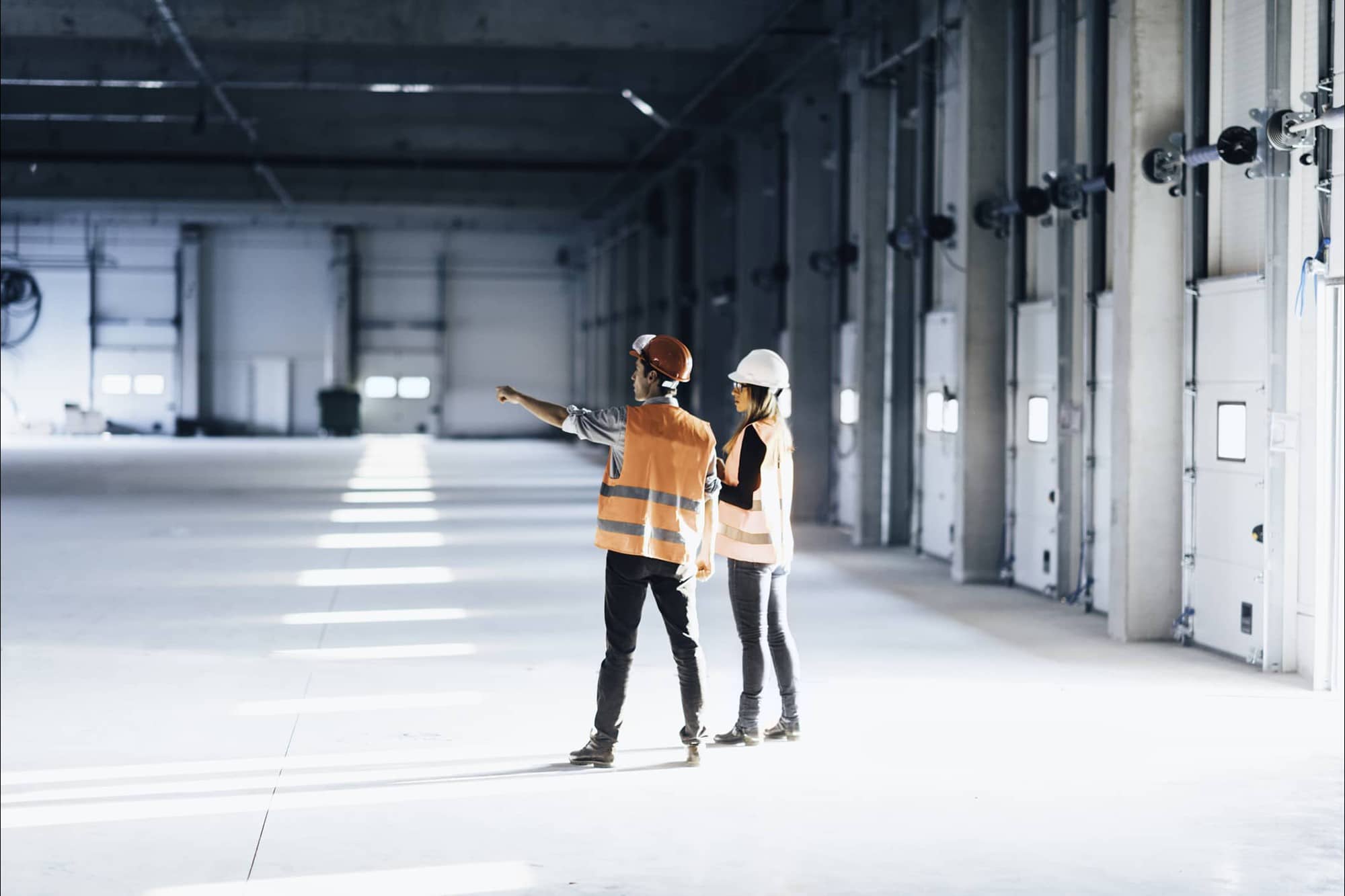 two safety workers in empty building