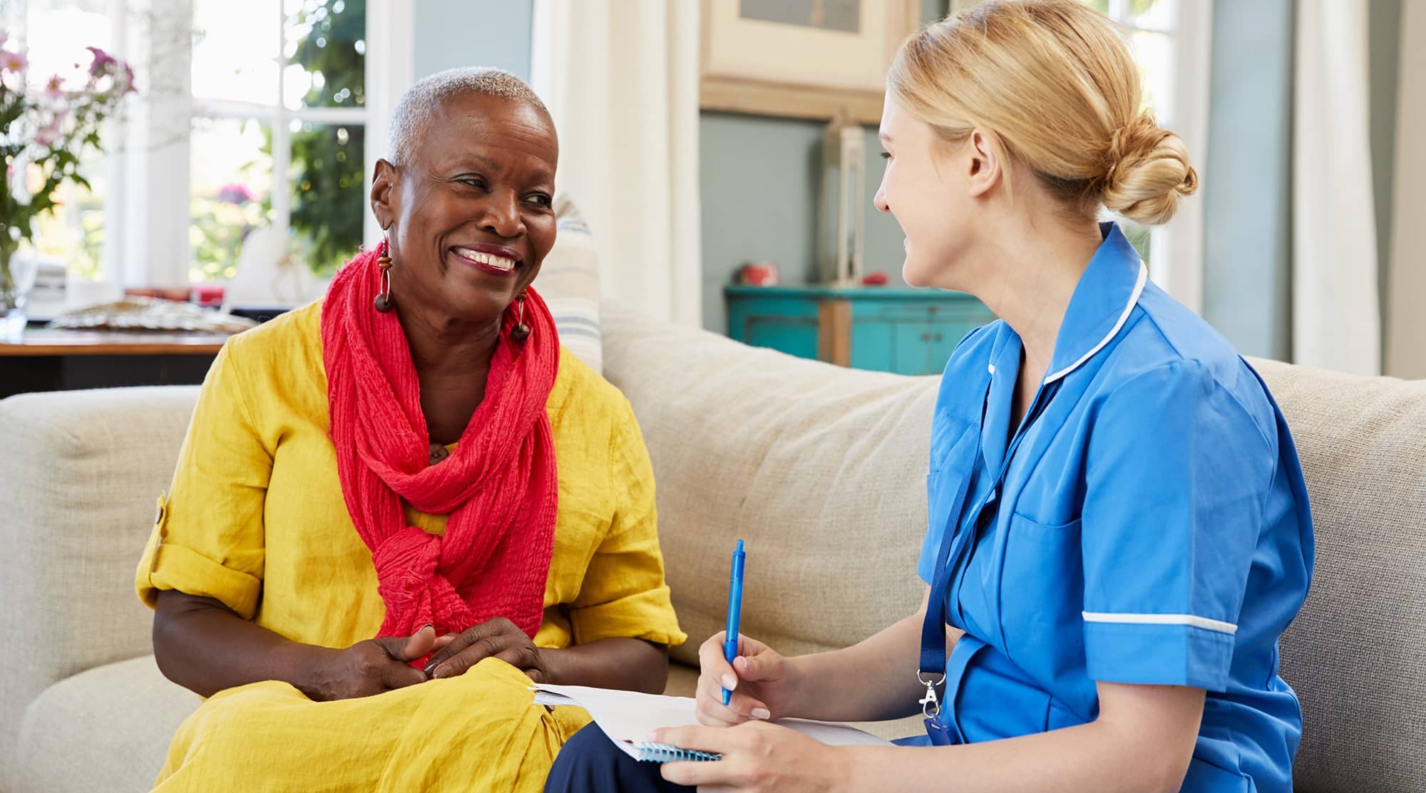 healthcare worker talks with patient