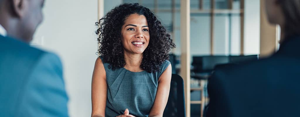 people smiling in meeting