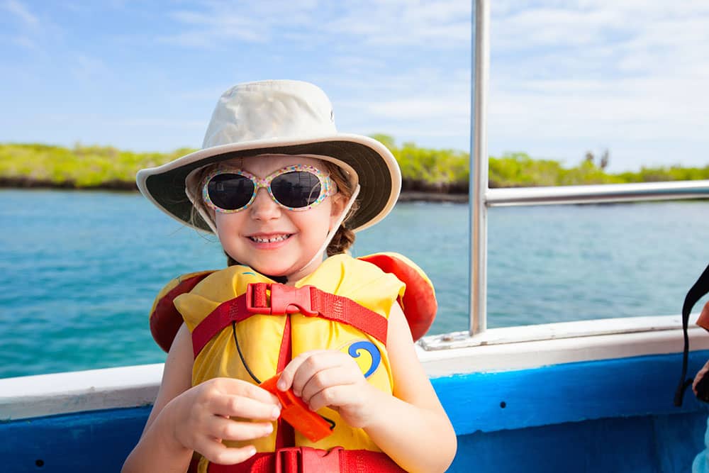Young Girl in Sunglasses on Boat