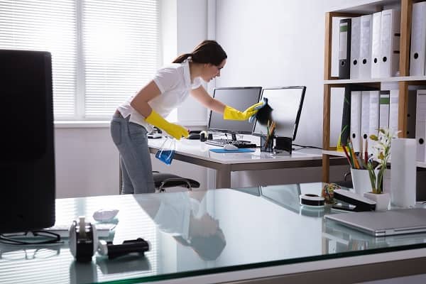 Woman cleaning office