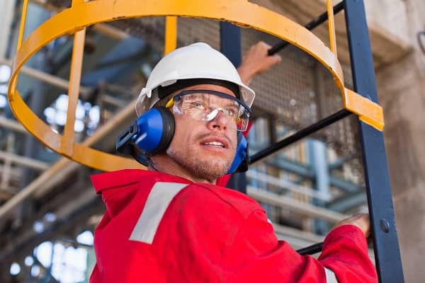 Man wearing protective hearing equipment