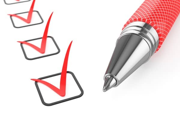 Red pen on checklist