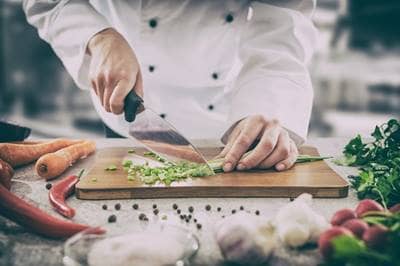 Chef slicing veggies