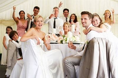 Wedding couple visiting reception table